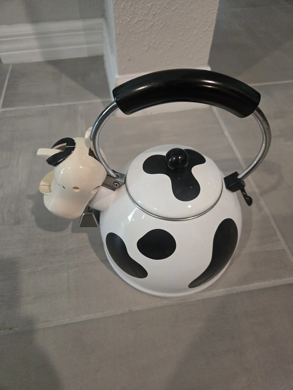 vintage M. Kamenstein black-and-white cow whistling tea kettle